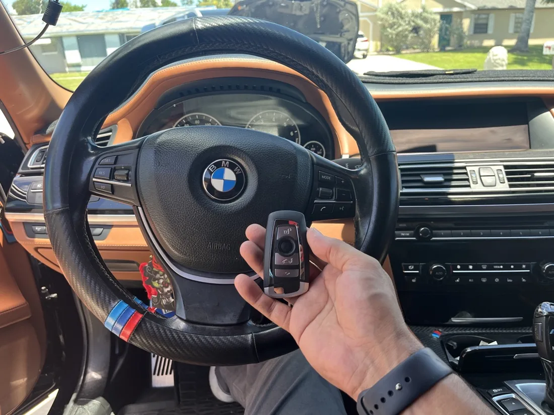 BMW interior with a key fob and dashboard controls
